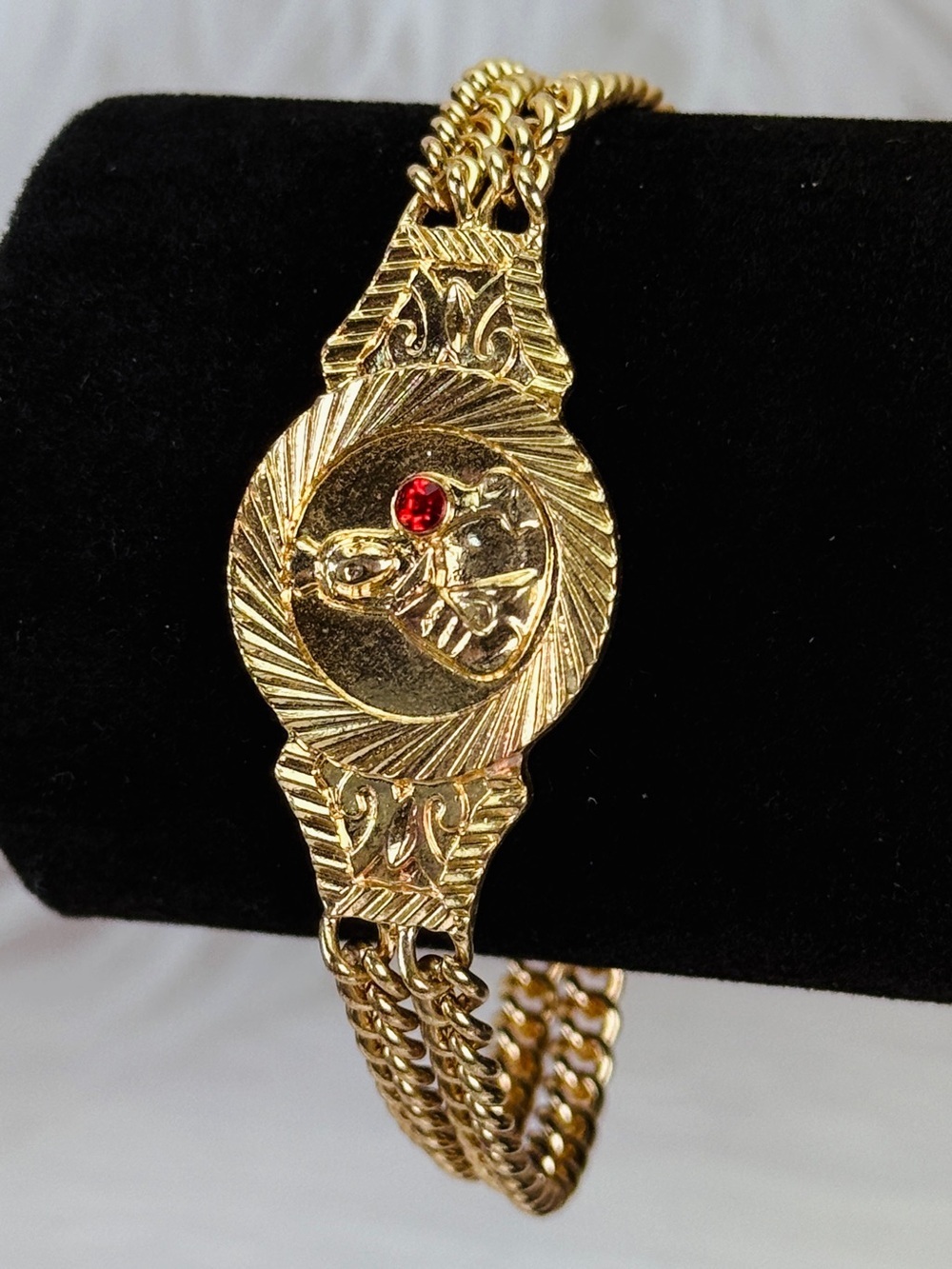 Elegant Goldtone Religious Bracelet with Red Accent